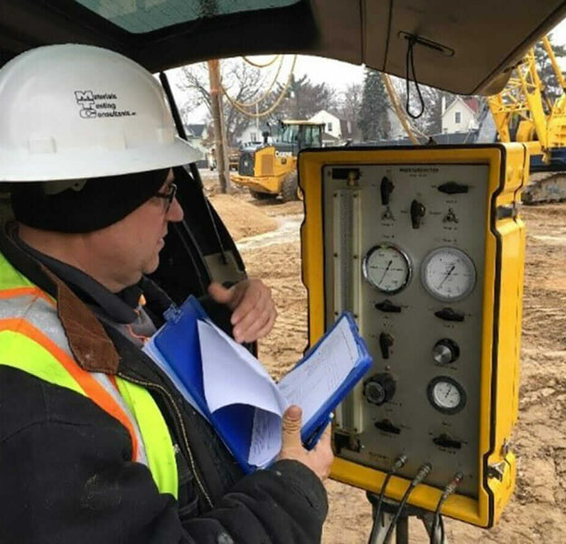 MTC CMT field staff using geotechnical equipment for an environmental assessment